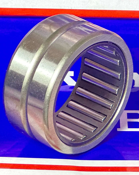 NK32/20 Needle roller bearing 32x42x20mm - Machined Type, close-up view of metal bearing without inner ring on blue background.