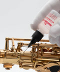 Key and Rotor Oil with Precision Needle Tip Applicator for Brass and Woodwind Instruments, 0.5 Oz, applied to saxophone keys