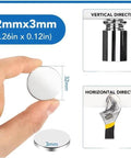 Hand holding a Neodymium Disc Magnet 32mm Diameter 3mm Thick With Double Sided Adhesive, shown with size comparison and applications.