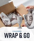 Person wrapping a vase with Newsprint Packing Paper Sheets For Moving 10 Lb 320 Sheets 27 By 17 Made In USA For Wrapping Dishes