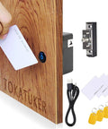 Discreet USB powered cabinet lock with NFC and RFID access for wooden drawers, shown installed on wood with cards and USB