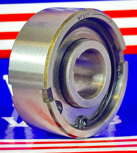 Close-up of NFS17 one way clutch 17x47x19mm sprag freewheel backstop clutch with visible external bearing support on blue background.