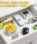 AA And AAA NiMH 2800mAh Rechargeable Batteries Bundle With 8 Slot Type C Charger in a drawer with devices like a camera and remote control