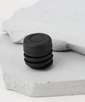 Close-up of a single black rubber stopper from 4Pcs Hood Rubber Bumper Stopper Set Fits Nissan Pulsar NX 1983-1990 And 200SX 1984-1988
