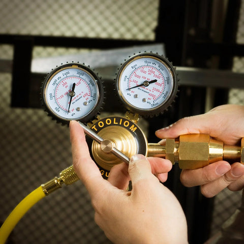 Hands adjusting Nitrogen Regulator With Six Foot Seven Inch Hose For TIG MIG Welding CGA580 Inlet Connection, gauges visible.