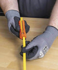 Person using Five In One Cable Stripping Tool for 12 to 14 AWG NM Cable Jacket Slitting and Precision Insulation Stripping