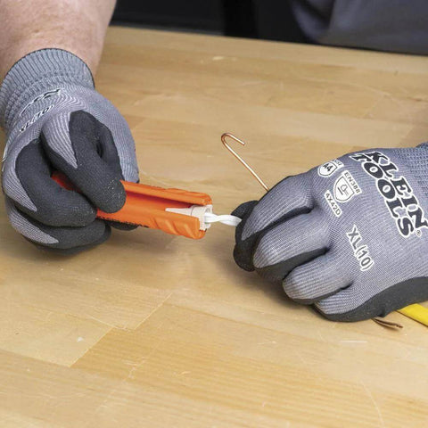 Electrician using Five In One Cable Stripping Tool For 12 To 14 AWG NM Cable Jacket Slitting And Precision Insulation Stripping