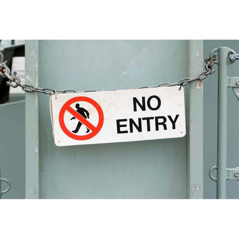 No entry sign with chain, metal background