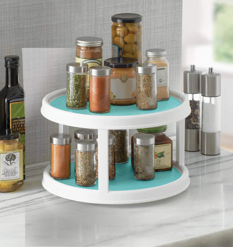 Non-Skid 2-Tier Turntable 12-Inch Lazy Susan Organizer with spices on marble countertop.