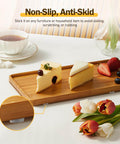 240 Piece Self Adhesive Cabinet Door Bumpers One Half Inch Clear Silicone Cushions shown on a wooden tray with cheese slices