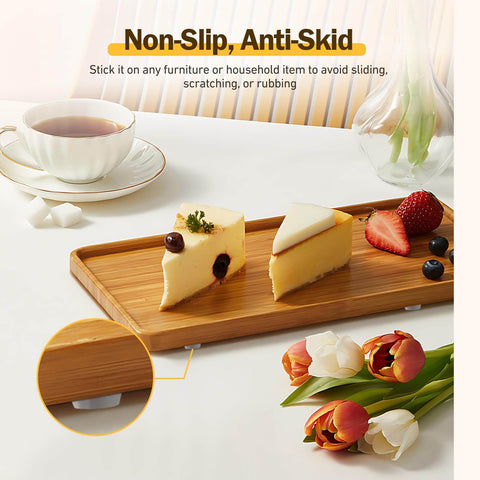 240 Piece Self Adhesive Cabinet Door Bumpers One Half Inch Clear Silicone Cushions shown on a wooden tray with cheese slices