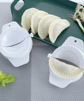 No Fuss Dumpling Maker Press Kit 3Pcs Small Nonstick Plastic Dumpling Mold For Pierogi on kitchen counter with filled dumplings