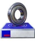 NSK 6207ZNR 6200 Series single row deep groove ball bearing on blue packaging, metal shield, snap ring visible
