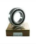 High precision NSK 6208TCG12P4 single row deep groove ball bearing on a box displaying smooth rotation design with inner ring guided phenolic cage