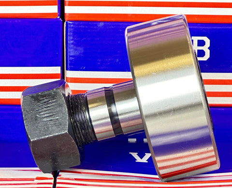 Side view of NUKR90 Track Roller Cam Follower Needle Roller Bearing 30x90x100mm against box packaging