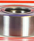 Side view of NURT35 Flat Yoke Roller Bearing 35x72x28mm on a vibrant striped background