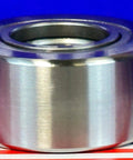 NUTR25 Flat Yoke Roller Bearing 25x52x24mm stainless steel side view on striped background