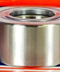 Side view of NUTR30 Flat Yoke Roller Bearing 30x62x28mm on a colorful background