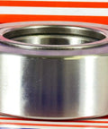 NUTR50 Flat Yoke Roller Bearing 50x90x30mm side view, silver metal, VXB Bearing, sealed, displayed on striped background