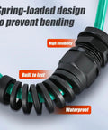 Close-up of Durable Nylon Cable Gland Half Inch Diameter Wire Waterproof Strain Relief With Tight Clamp And O Ring Seal IP68 NPT Half Inch For Outdoor Electrical Boxes, 10 Pack with green cable and spring-loaded design