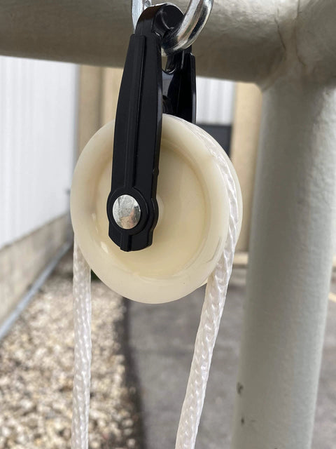 2-1/2-Inch Diameter Nylon Pulley - Durable, Smooth Outdoor Clothesline Pulley for 1/4-Inch Rope, 4 Pack installed on pole