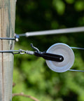 2 PCS Nylon Clothesline Pulley,2-1/2-inch Diameter Nylon Pulley installed outdoors on wooden post with rope