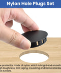 Hand holding Nylon Hole Plugs Set 30Pcs With Four Sizes 1-1/2 In, 1-3/4 In, 2 In, 2-3/8 In Round Snap-In Locking Hole Covers in black