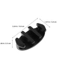 Close-up of black nylon deck-mount boat rope cleat with four prongs.