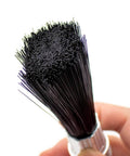 Close-up of Lubricating Round Oil Brush For Chains And Guideways, Nylon Bristles Held in Hand, Ideal for Machinery Maintenance