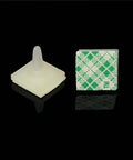 Close-up of two nylon spacers from 100 Piece Nylon PCB Spacers Set With Sticky Adhesive Base And Locking Snap In Posts 3mm Height
