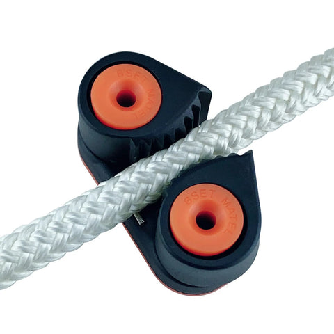 WEISUYUUS nylon rope clamp cleat, close-up view, black body with orange inserts and braided white rope
