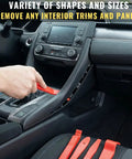 Close-up of 8 Piece Auto Trim Removal Tool Set Nylon Pry Tools being used on car dashboard panel for scratch-free removal.
