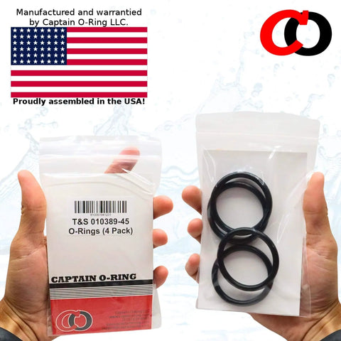 Hands holding a package of Replacement Plunger O Rings For Three Tier Sink Drains Easy Install Fits 3 Inch And Three Point Five Inch Twist Waste Valves Compatible With Part Number 010389 045 Rubber Stopper O Ring Set Four Pack with four black O-rings and USA flag in background.
