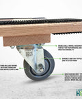 Close-up of 3.5 inch rubber wheel of American Made Solid Oak H Frame Furniture Dolly For Moving Heavy Loads 18 By 30 Inches with labels