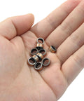 Hand holding Oil Free Sleeve Bearings 10 Pcs 6mm Bore 8mm OD 4mm Length for engineering and automotive use, bronze coating.
