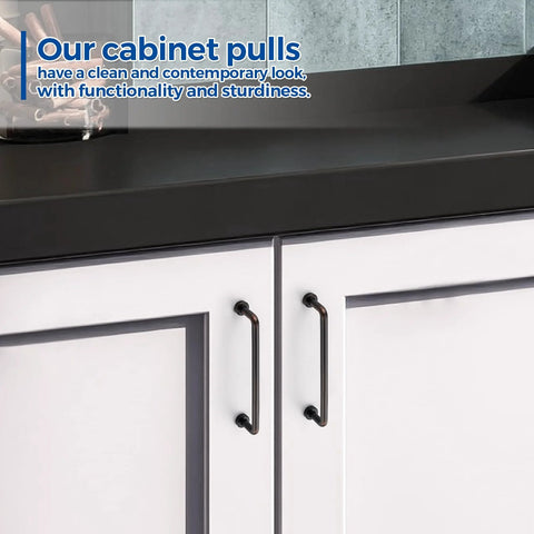 Oil Rubbed Bronze Cabinet Pulls 5 Inch Hole Center Zinc Alloy Vintage Style Handles installed on white kitchen cabinet doors