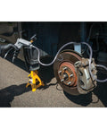Using hand vacuum pump for brake bleeding on vehicle wheel