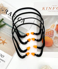 Orange Banded Earplugs For Shooting Range 4 Piece Set Reusable Silicone Hearing Protection With Neck Band displayed on magazines