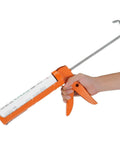 Caulking Gun With Ten To One Thrust Ratio No Drip Design For Precise Bead Control shown in use dispensing material