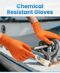 Person wearing orange 8 Mil Nitrile Disposable Gloves Heavy Duty Mechanic Large 100 Count Powder Free while painting metal part.