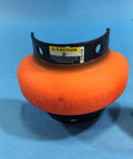 Orange mechanical coupling element with caution label, used in industrial shaft applications, on blue background.
