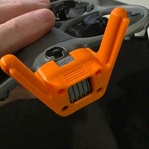 DJI Neo 2 Antenna Protective Cover Orange Rugged Precision Fit Drone Accessory With Snap On Installation For Enhanced Antenna Protection Weatherproof Shield Safe Flights In Harsh Environments shown attached to a drone
