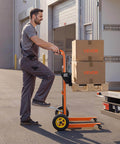 Side view of a person using a Heavy Duty Hydraulic Material Lift Stacker With 450 Lb Load Capacity And 39.4 Inch Lift Height, Orange and Black.