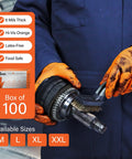 Mechanic using Orange Nitrile Disposable Latex Free Gloves Raised Diamond Grip Medium for automotive work.