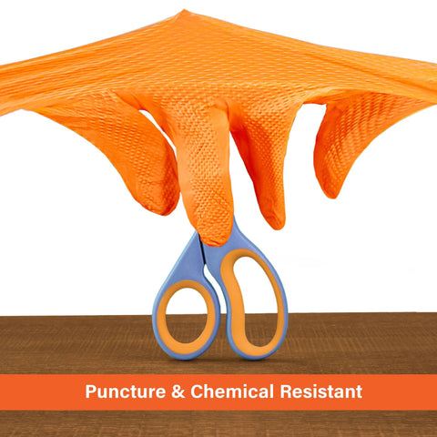 Demonstration of Orange Nitrile Disposable Latex Free Gloves Raised Diamond Grip Mechanic Medium proving puncture resistance against scissors
