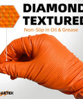 Close-up of diamond textured orange glove gripping bolt, showcasing 8 Mil Nitrile Powder Free Gloves Diamond Textured Heavy Duty Orange 100Pcs.