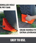 Heavy Duty Wheel Chocks Two Pack That Prevents Movement On Slopes For Boat Trailers RVs Trucks And Campers All Weather Non Slip Solid Rubber With Orange Color By SecurityMan, shown with predrilled hole and grab handle.