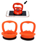 Two Pack Suction Cup Lifter for Glass and Tile with orange grips, shown lifting a smartphone
