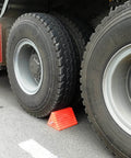 Heavy Duty Orange Wheel Chocks 2 Pack With Eyebolt For Travel Trailer securing truck tires on asphalt