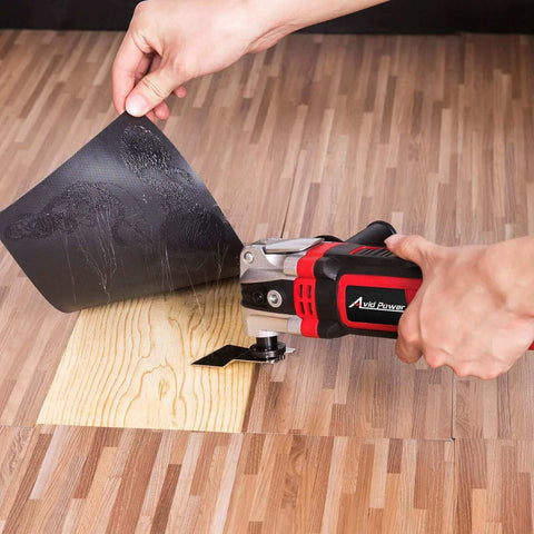 3.5 Amp Oscillating Multi Tool with 4.5 Degree Oscillation cutting wood flooring, showing 6 variable speeds and auxiliary handle.